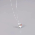 Minimalist luxury pendant necklace featuring a heart-shaped gradient charm with sparkling crystal detail. Chic women’s jewelry accessory designed for elegant everyday fashion and gifting.